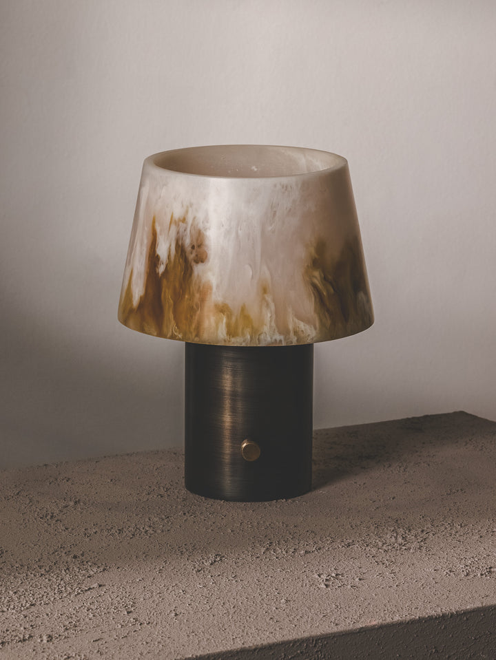 Table lamp composed of steel base, resin shade and brass hardware.