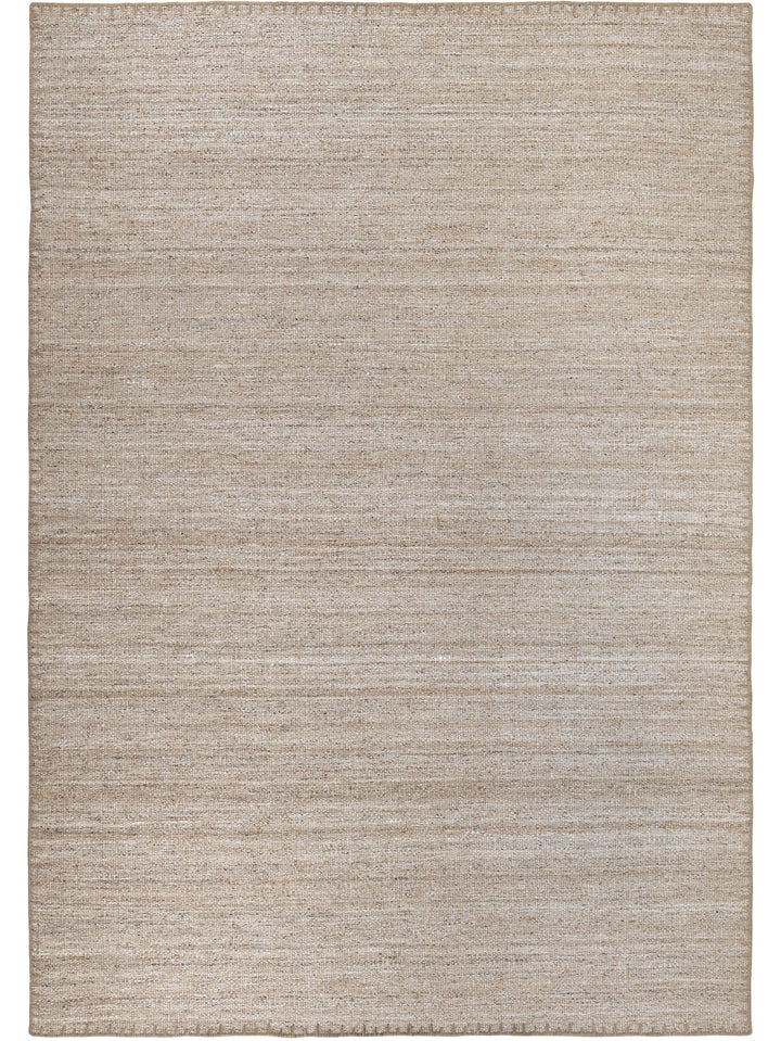Beige area rug with a subtle pattern 