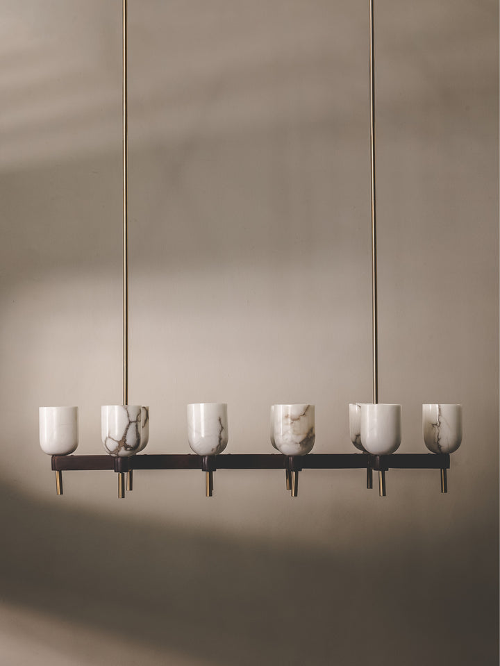 Chandelier composed of mango wood and steel, and features 10 shades made of semi-translucent alabaster.