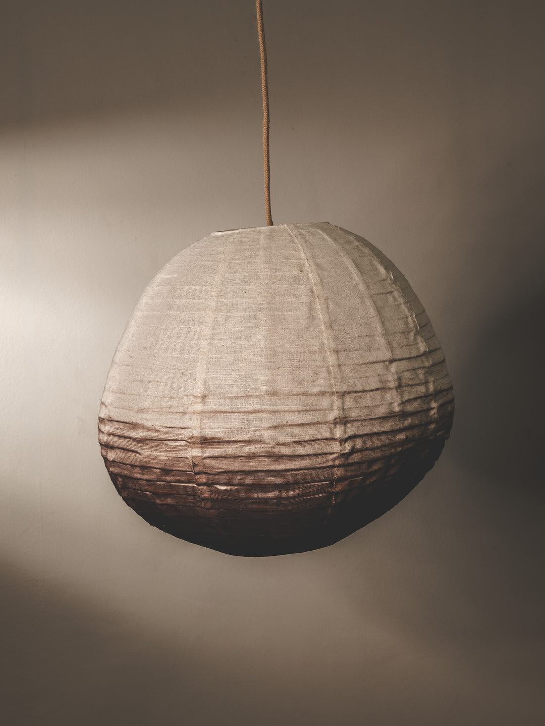 Linen fabric covered lantern pendant in mocha ombre colourway.