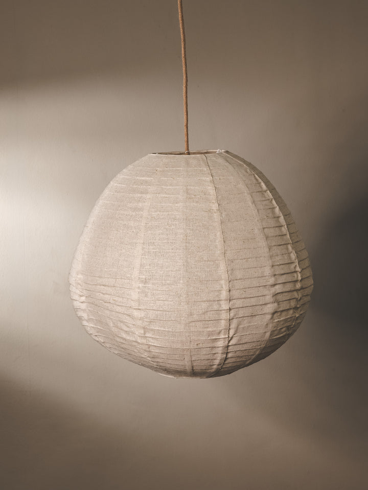 Linen fabric covered lantern pendant with foldable design in natural colourway.