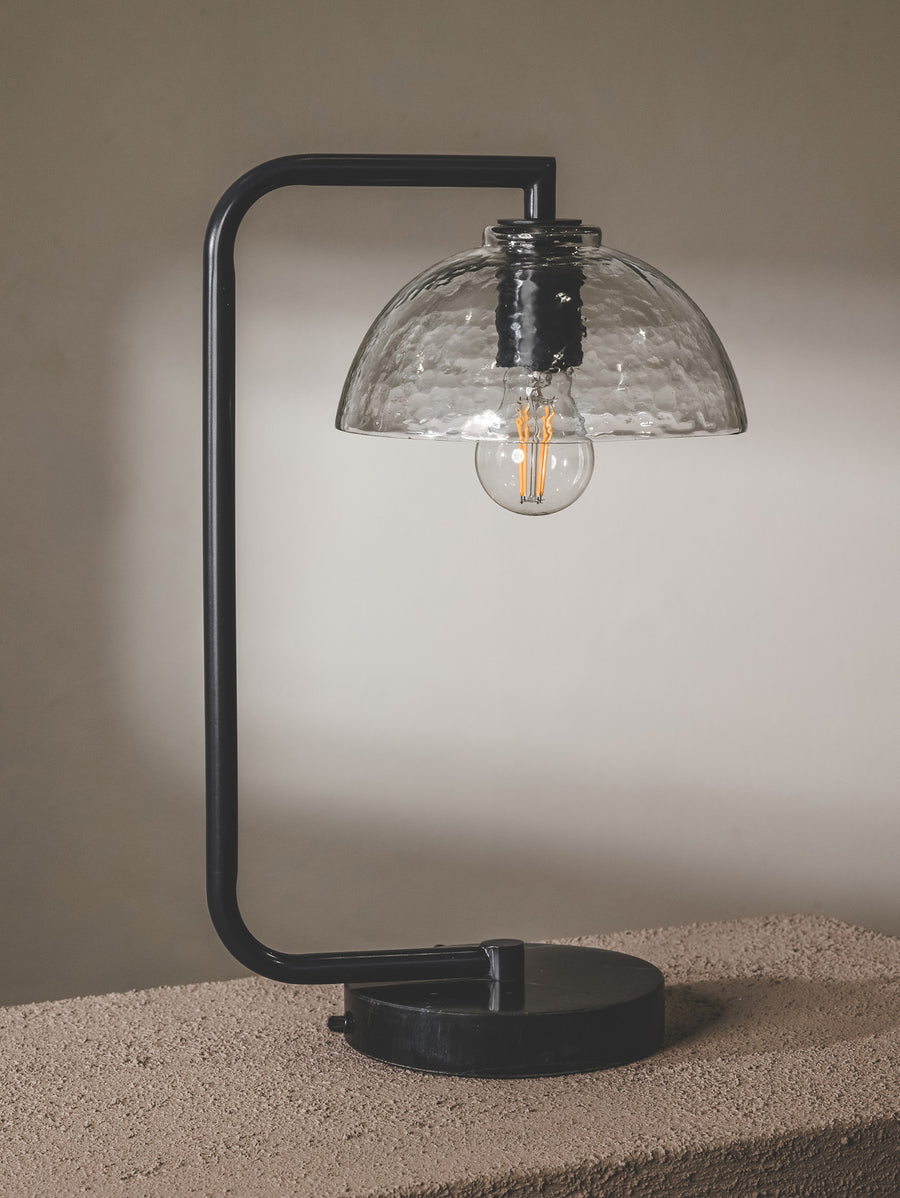 Chic desk lamp with steel frame, glass shade and marble base in black colourway.