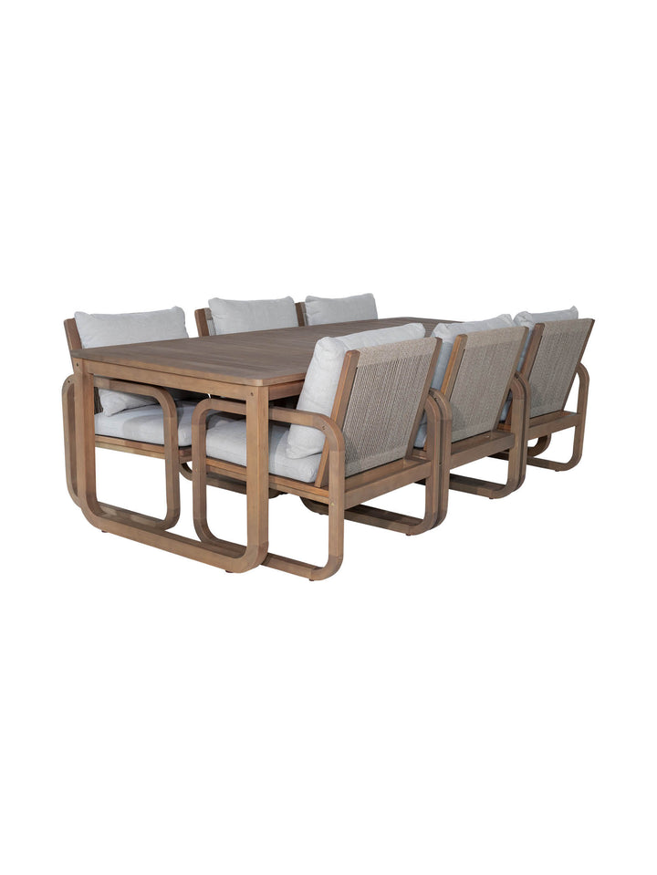 Outdoor dining chairs and table set made from eucalyptus wood and olefin covered seat cushions 