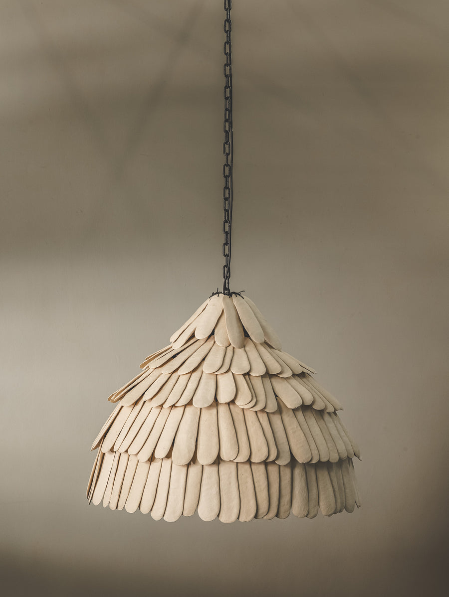 Locally crafted pendant light featuring a handmade ceramic shade in a bone colourway and durable steel support.