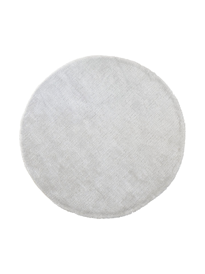 Round rug made of recycled material with a plain minimalist design