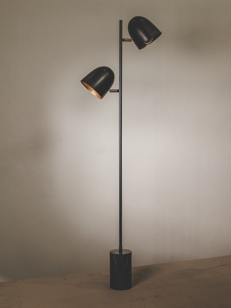 Handmade iron and marble floor lamp with two heads.