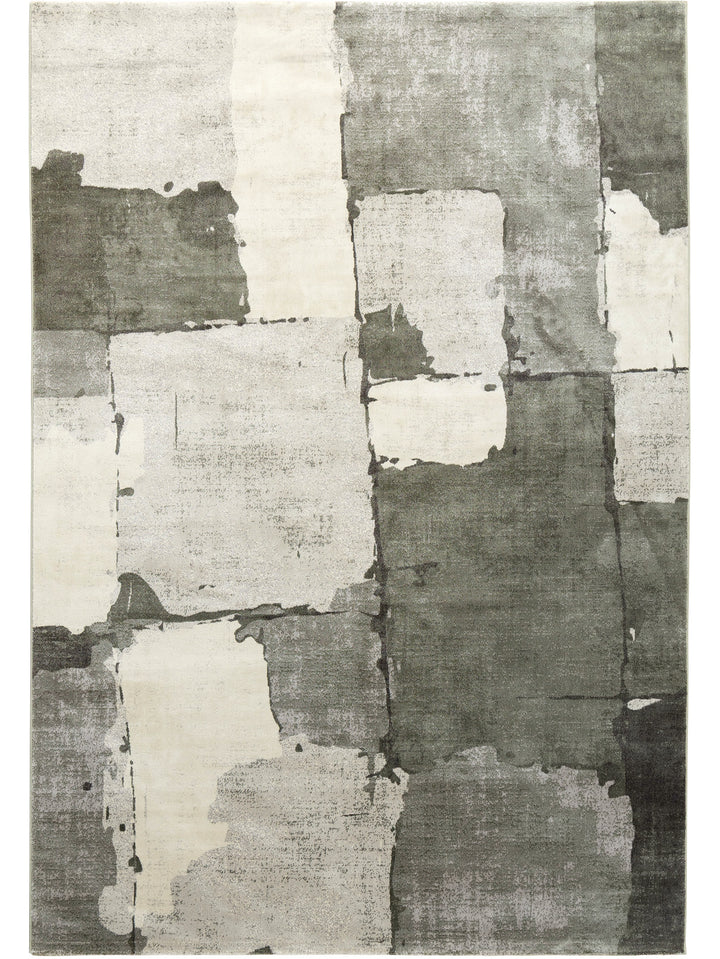 Abstract patchwork rug with geometric pattern in gray and white