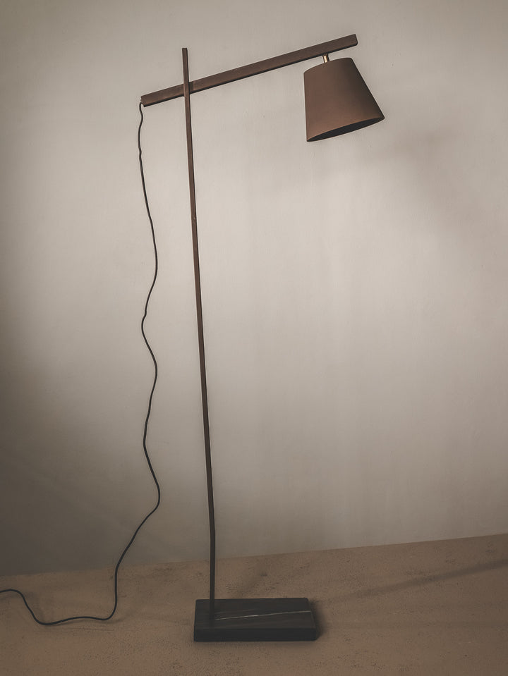 Floor lamp with a brown shade and marble base.