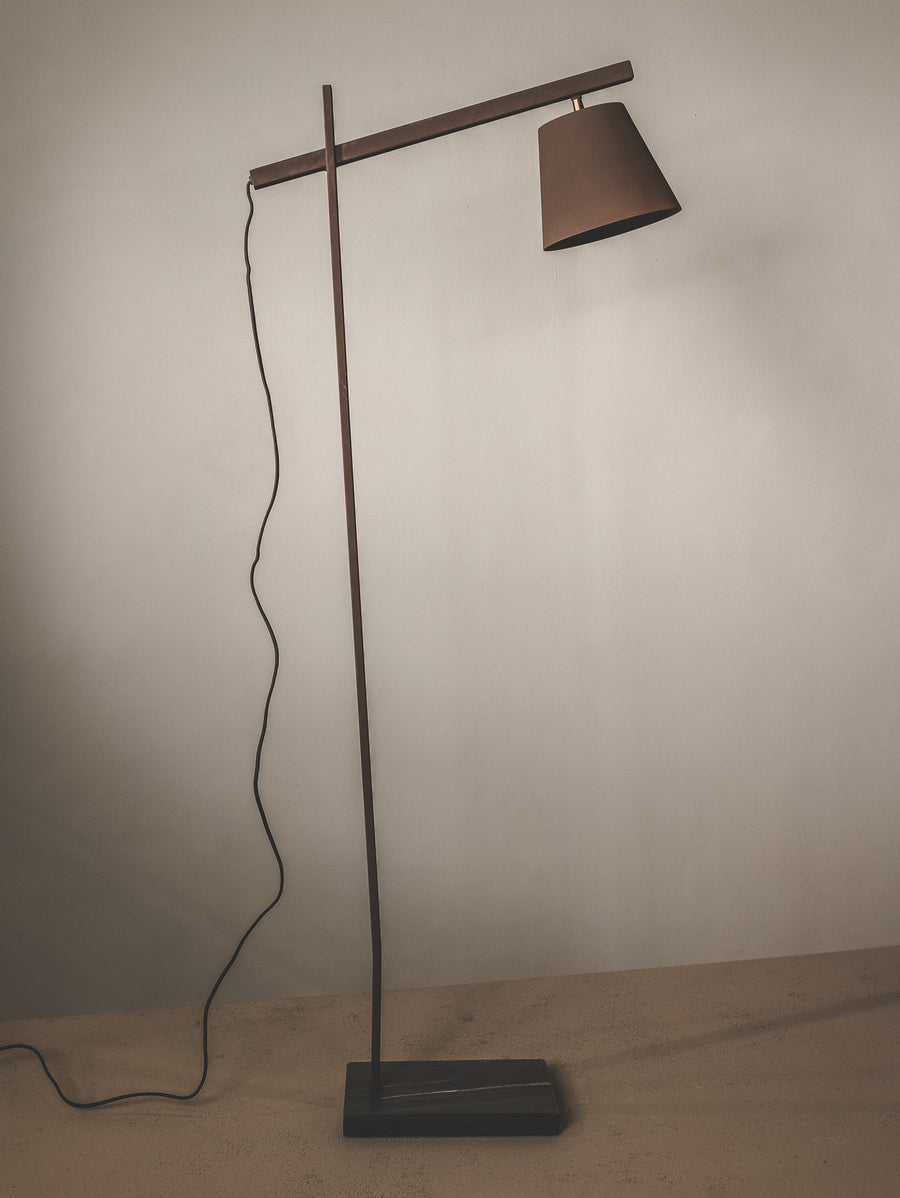 Floor lamp with a brown shade and marble base.