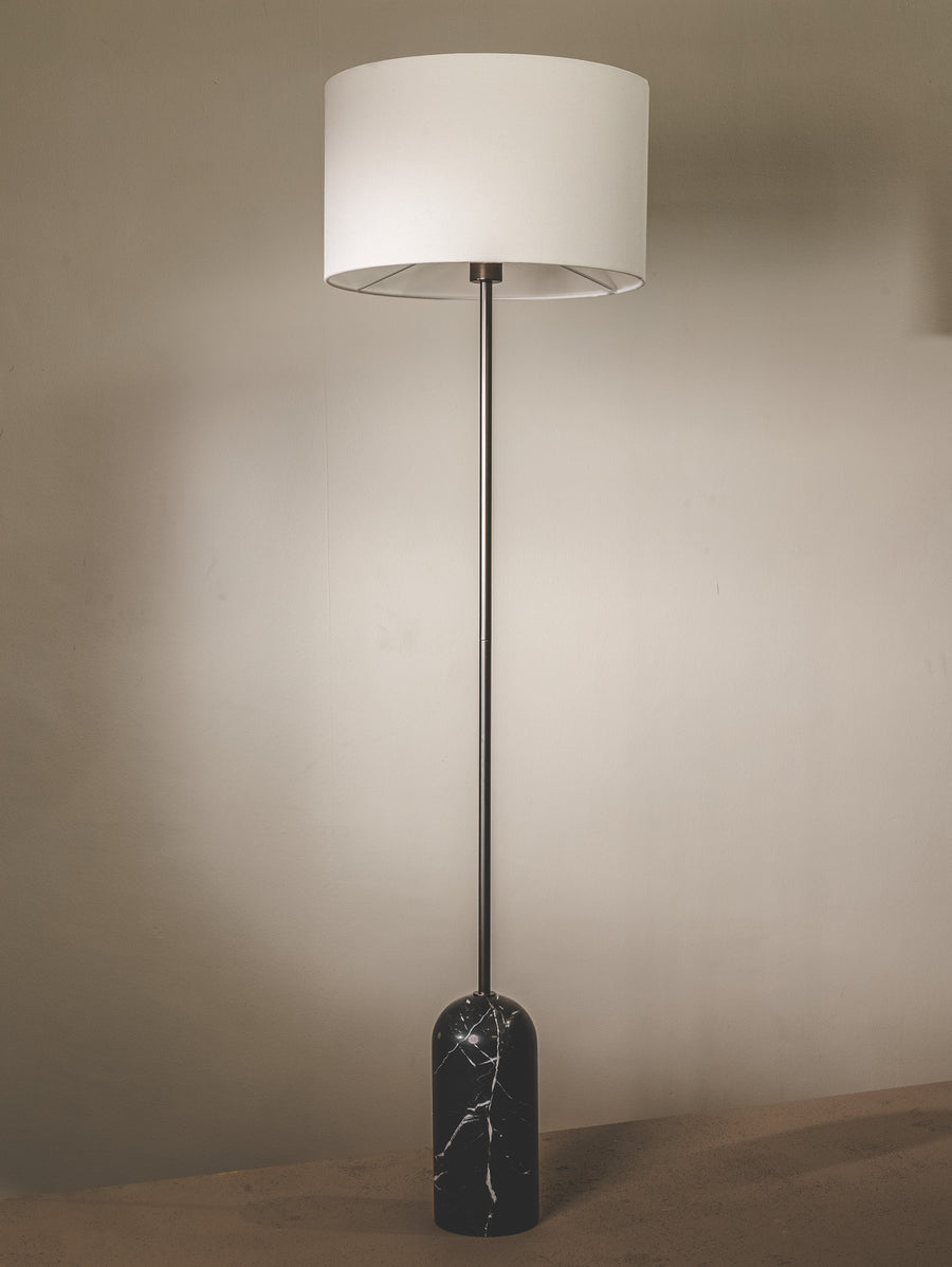 Marble floor lamp with fabric shade and brass fixtures.