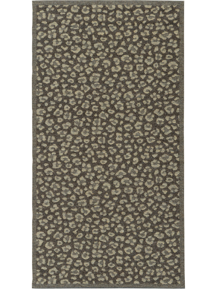 Brown rug with a leopard print pattern