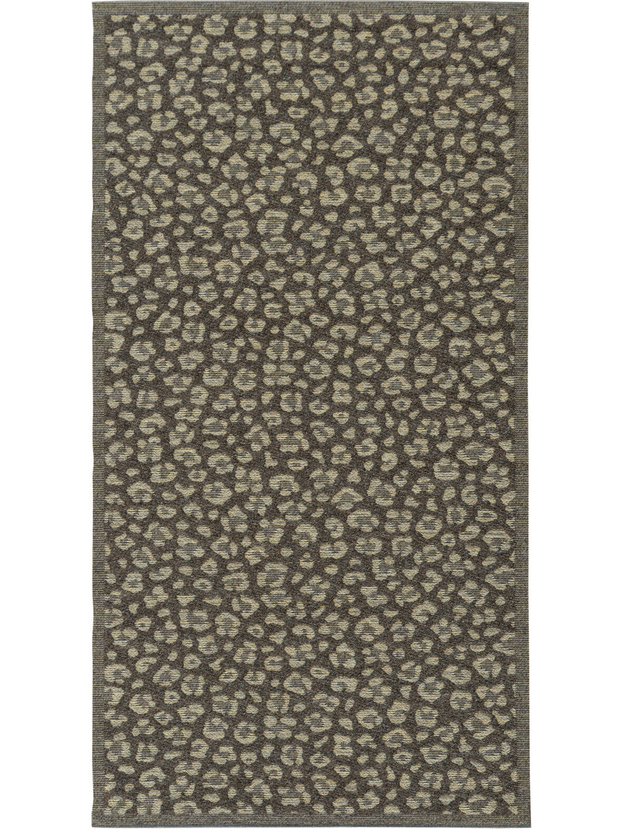 Brown rug with a leopard print pattern
