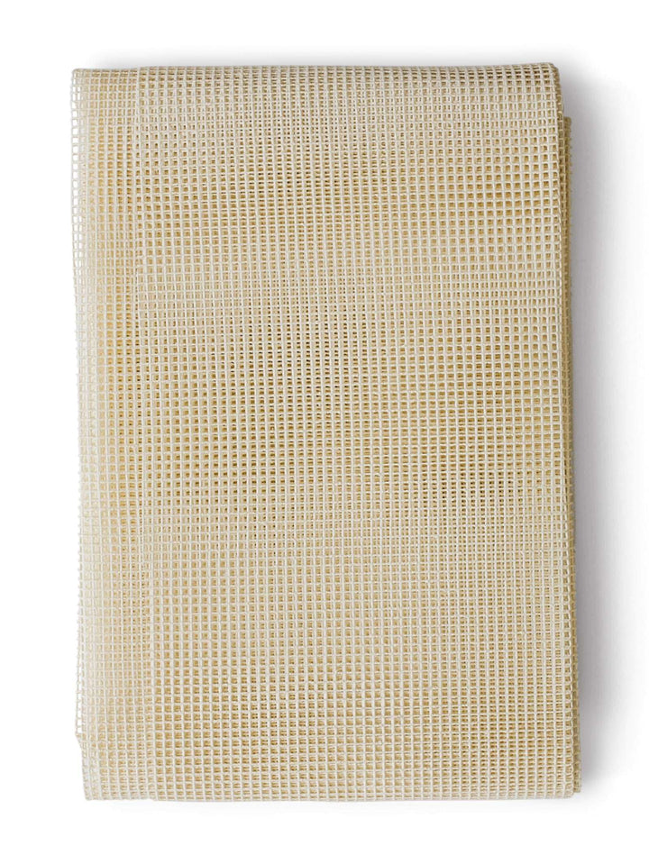 A beige anti-slip underlay for rugs to prevent slippage and movement of rugs